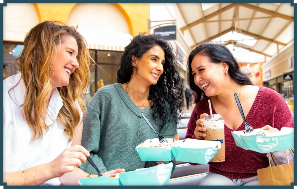 Women Happy and Eating at Tejon Outlet Mall